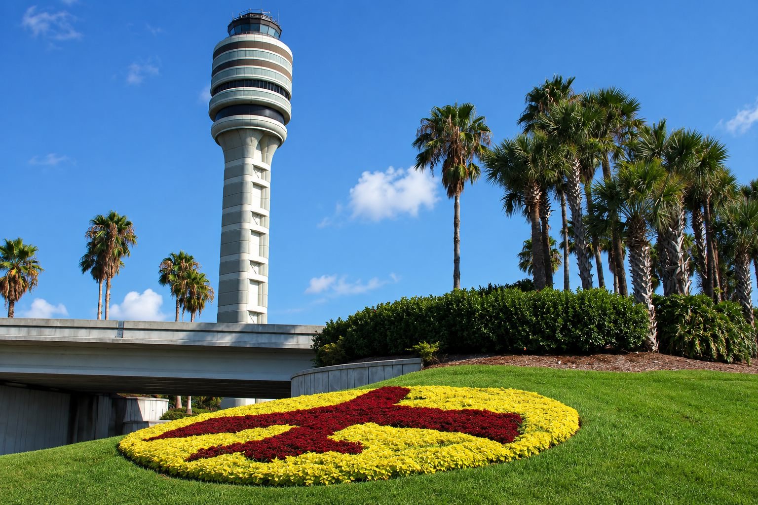 Orlando International Airport control tower surrounded by palm trees